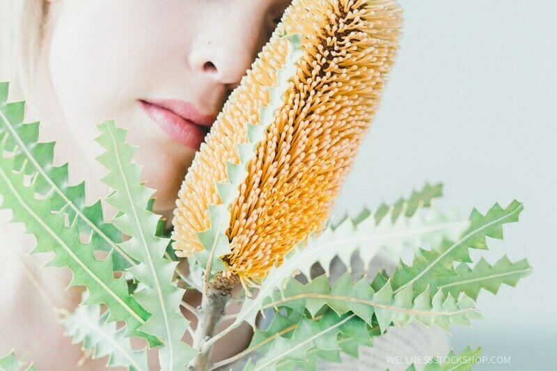 emotional sensual beautiful woman with exotic Australian banksia flower stock photo image