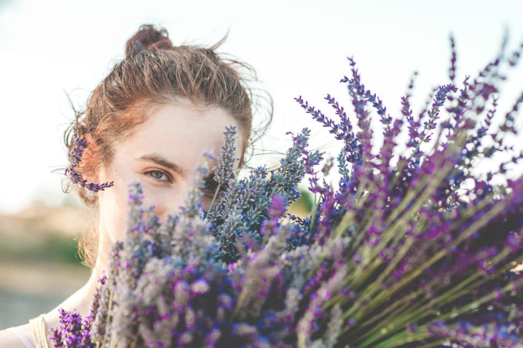 beautiful girl with fresh lavender flower bouquet stock photography