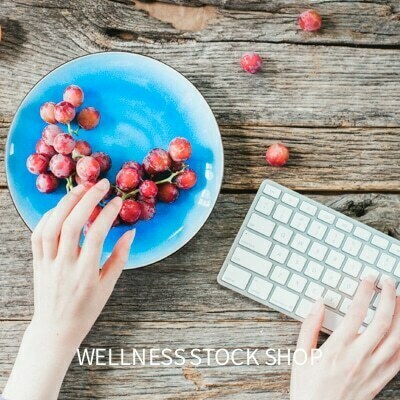 healthy entrepreneur desk scene stock image photo of hand on computer keyboard grabbing grapes