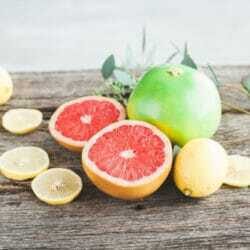 vibrant pomelo, grapefruit and lemon citrus fruit on rustic wood healthy stock photo image from Wellness Stock Shop